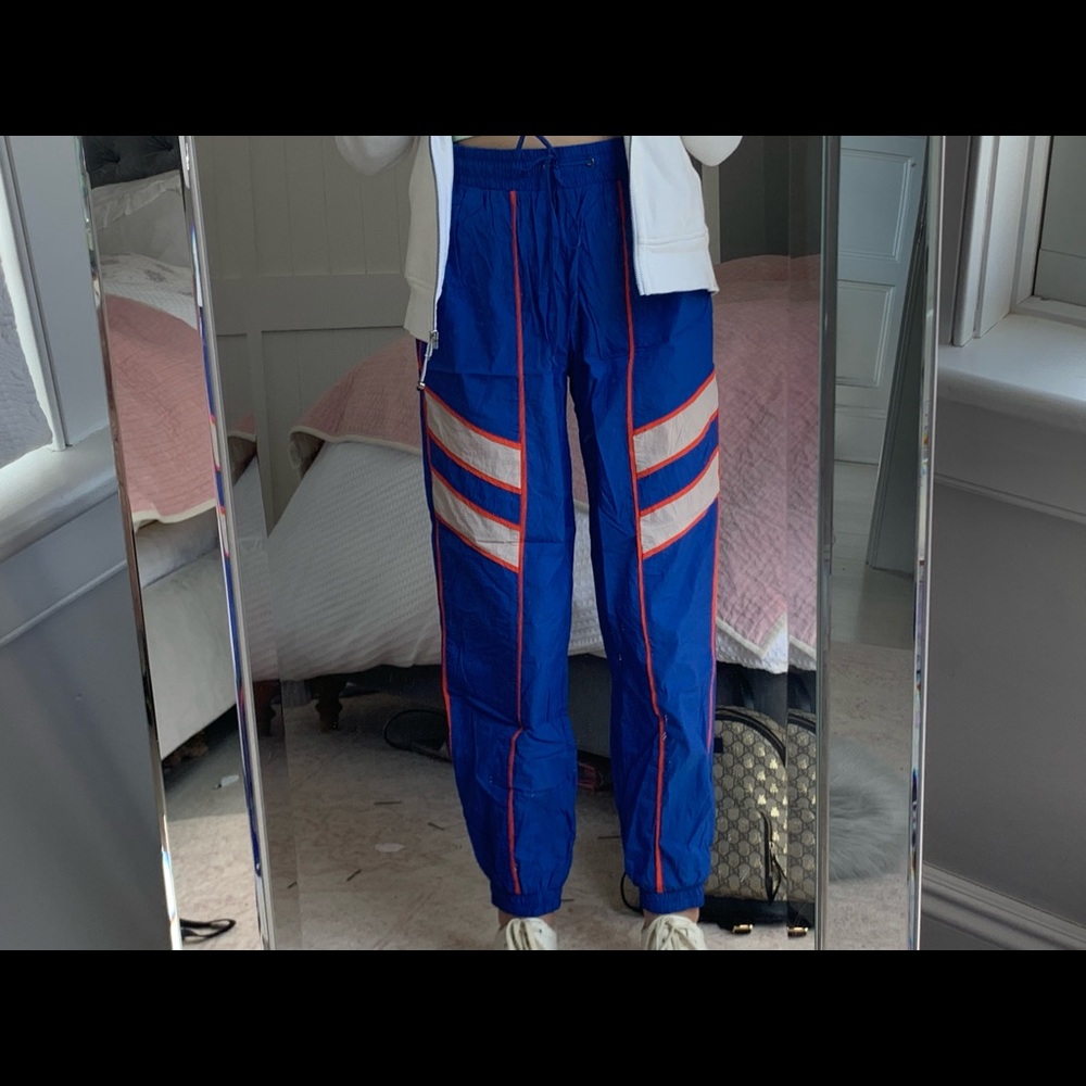 Blue reflective windbreaker pants